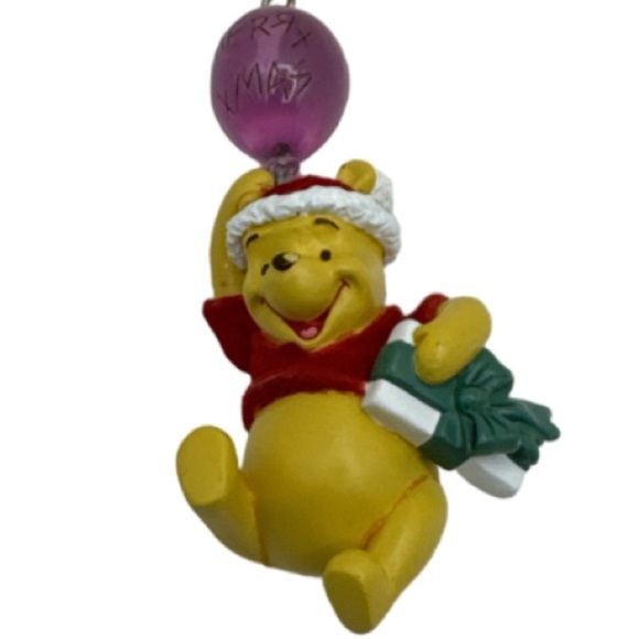 Disney Other - Winnie the Pooh figure ornament holding a balloon that says Merry Xmas